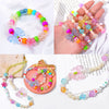 Assortment of colorful acrylic flower beads and stringing materials for DIY jewelry making projects