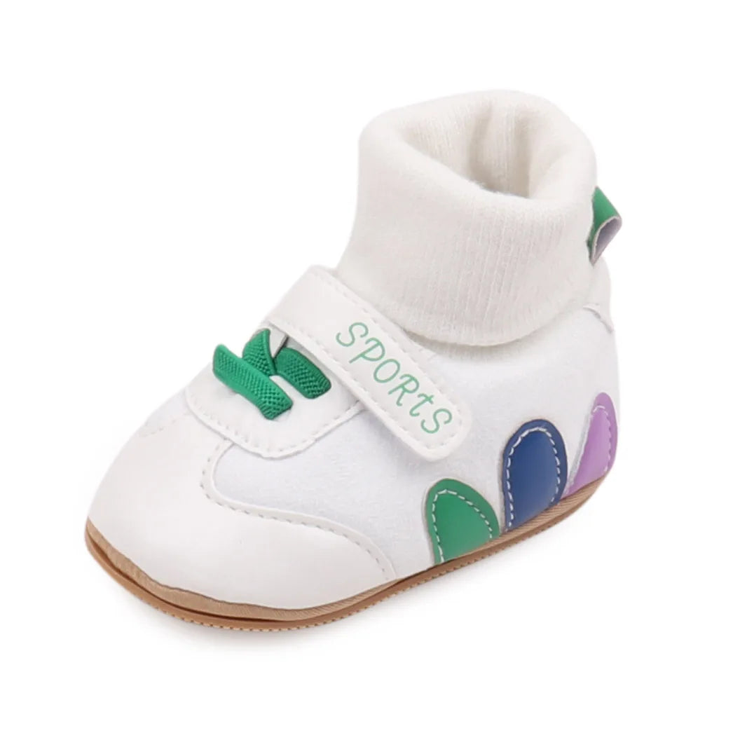 White baby booties with a knit cuff and colorful accents, featuring anti-slip soles.