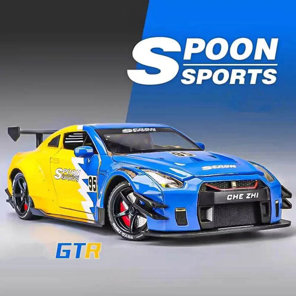 A blue sports car model is displayed against a blue background with Spoon Sports branding.