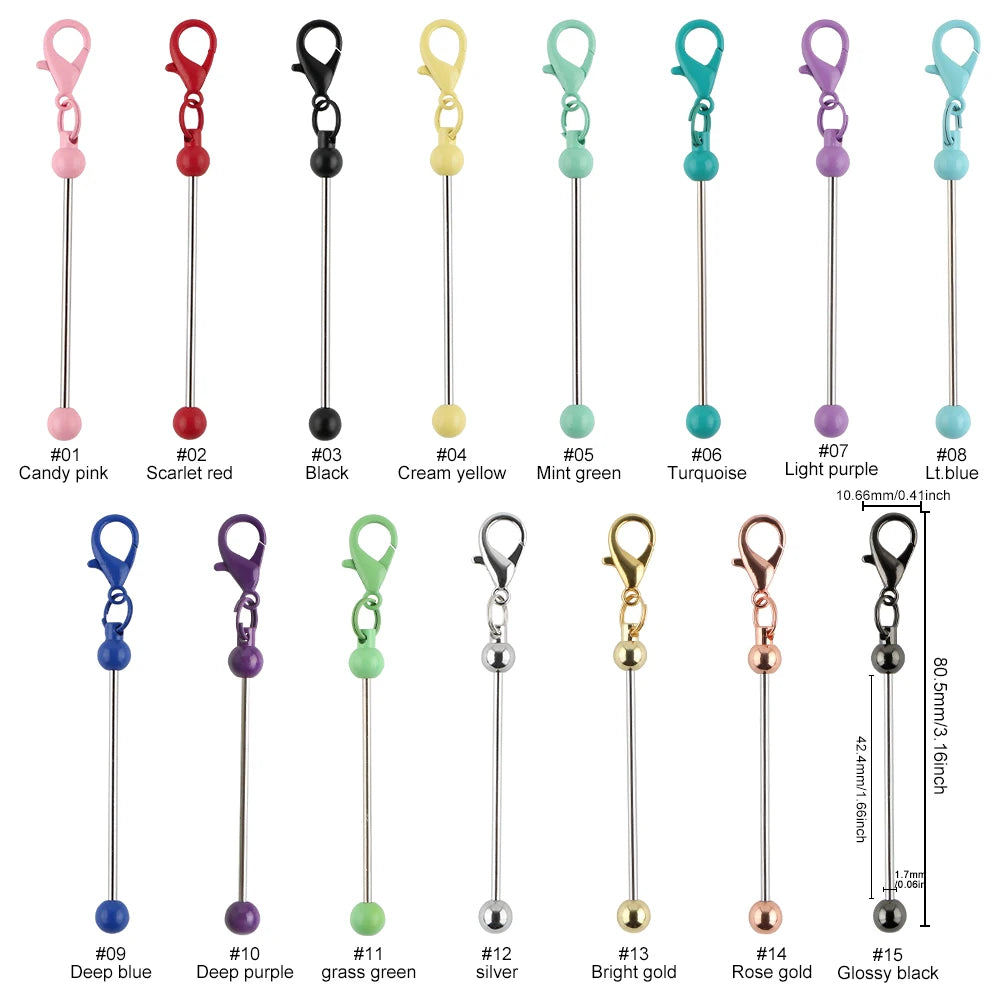 A collection of metal keychain bars with lobster clasps in various colors including pink, red, black, yellow, green, blue, an