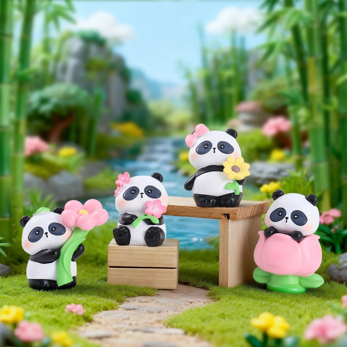 A set of cute panda collectible figures with pink flowers displayed on a wooden surface in a lush garden setting.
