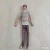 A pink-haired poseable plush doll figure wearing a striped top and purple pants.