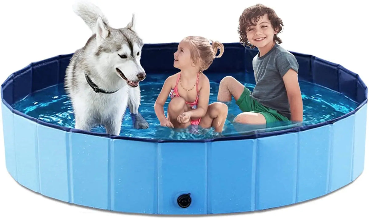 A dog and a boy are in a blue foldable pet bath tub with a quick-drain design.