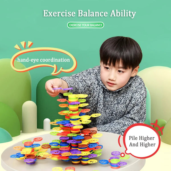 A child is stacking colorful rainbow blocks into a tower to exercise hand-eye coordination and balance ability.
