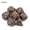 A set of coppery skull metal polyhedral dice for tabletop games