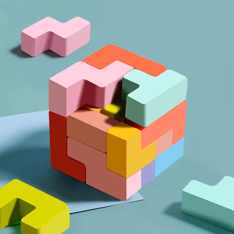 A colorful wooden 3D tangram puzzle set made of pink, orange, green, and yellow geometric shapes arranged on a light blue sur