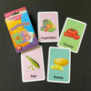 A collection of colorful flash cards featuring vegetables like tomatoes, potatoes, and peas.