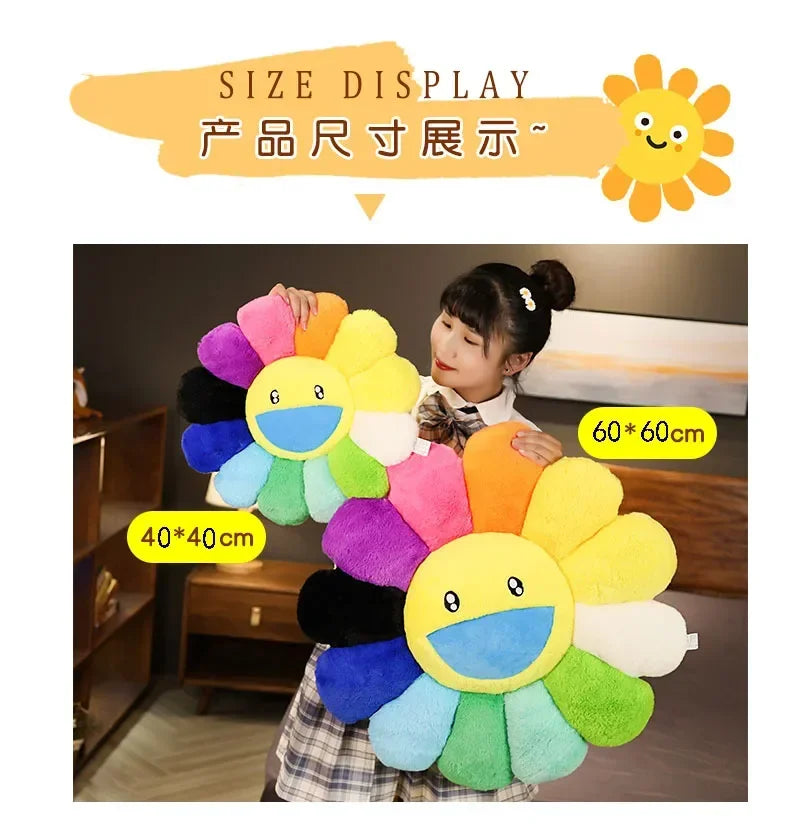 A large, colorful sunflower plush cushion is displayed against a neutral background.