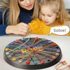 A children's educational logic toy called Rope Tangle Challenge featuring a black disk with colored ropes and wooden pieces.