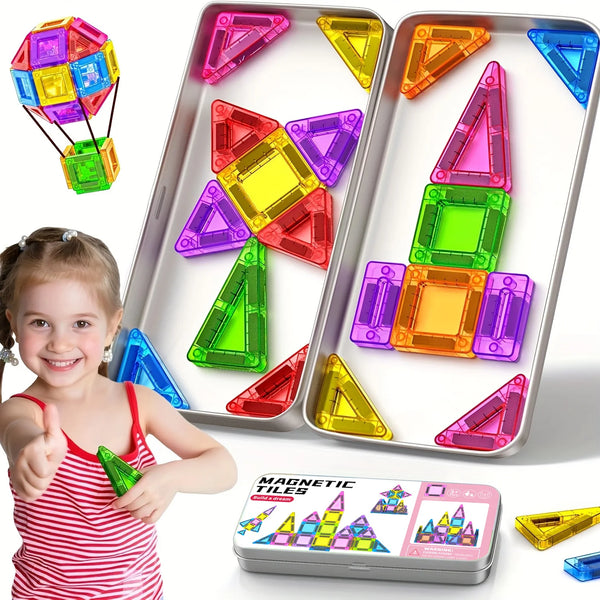 A child holds a tray of colorful magnetic tiles and a separate pack of mini magnetic building blocks for kids