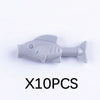 Ten gray plastic marine animal building blocks including a shark, octopus, and whale.