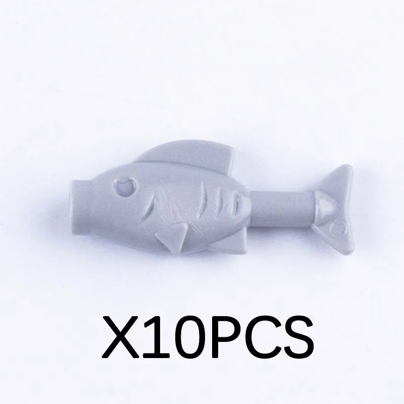 Ten gray plastic marine animal building blocks including a shark, octopus, and whale.