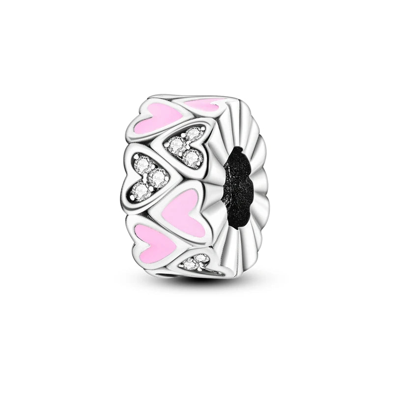 A silver heart charm bead featuring pink zirconia stones and a black center detail.