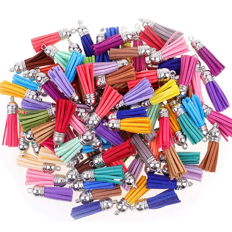 A collection of mixed color velvet tassels with silver findings for DIY jewelry and decor