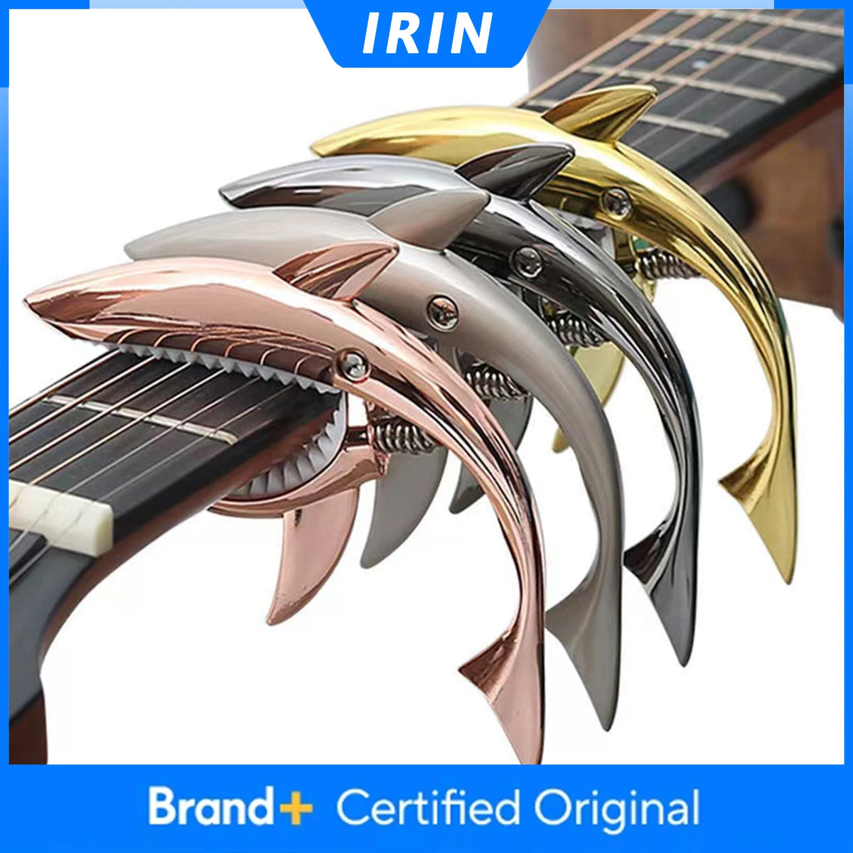 A set of metal shark guitar capos in various colors including gold, silver, and rose gold.