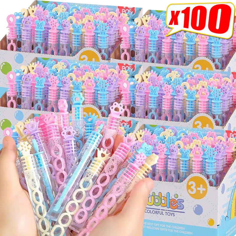 A box of colorful bubble wands with a 5-hole design for parties and gifts is shown being held by a hand.