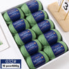 A box of YEDAN MERIN wool thread yarn in green, packaged for knitting projects.