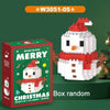 A white and red Christmas snowman figure made of micro blocks is displayed next to its packaging box.