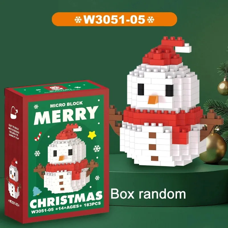 A white and red Christmas snowman figure made of micro blocks is displayed next to its packaging box.