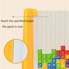 A close-up view of colorful 3D puzzle building blocks being stacked and measured against a yellow guide.