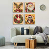 Three framed diamond painting artworks featuring reindeer, Santa, and a Christmas wreath.