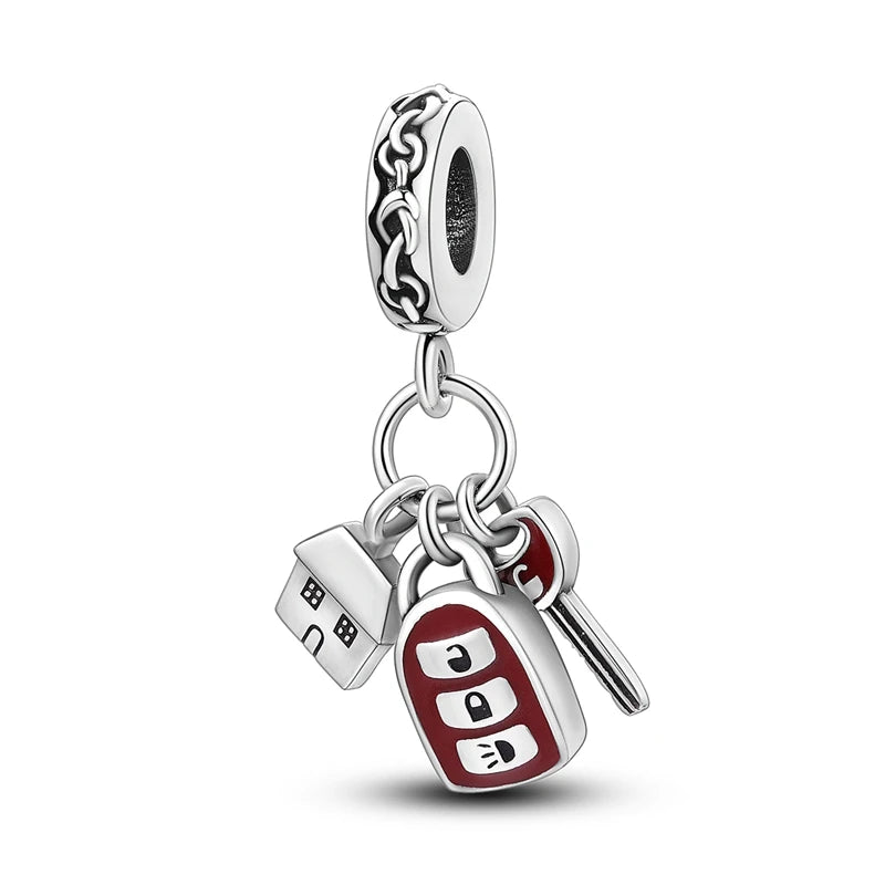 Sterling silver charm bead pendant featuring a car, key, and other charms on a chain.