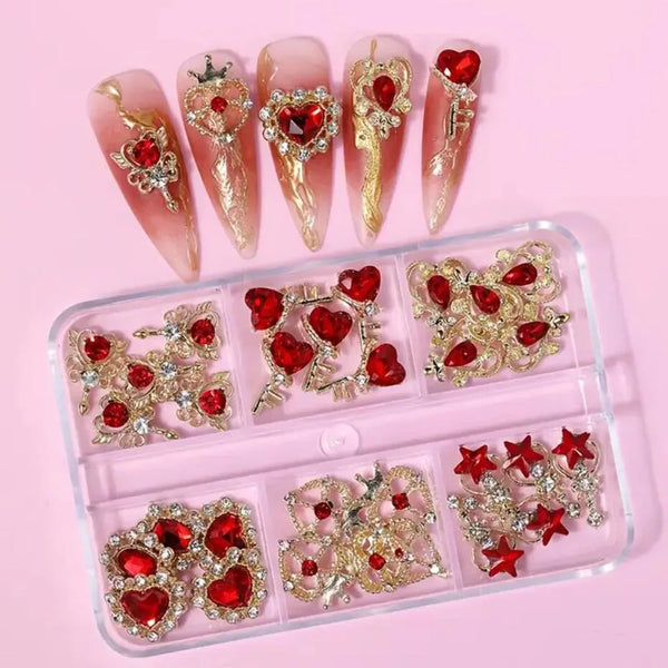 A set of 3D red love heart nail art charms and embellishments displayed on a pink background.