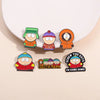 A set of five enamel pins featuring characters from South Park, including Cartman and Stan.