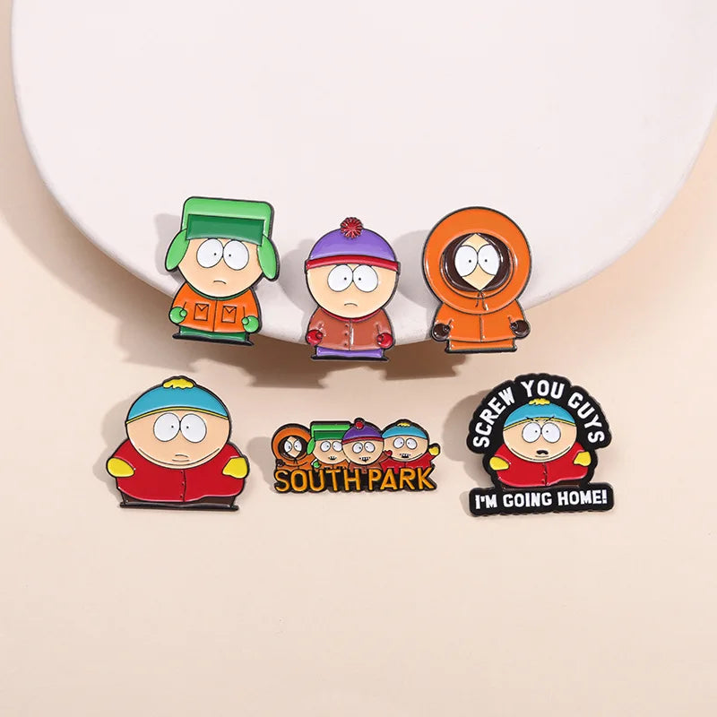 A set of five enamel pins featuring characters from South Park, including Cartman and Stan.