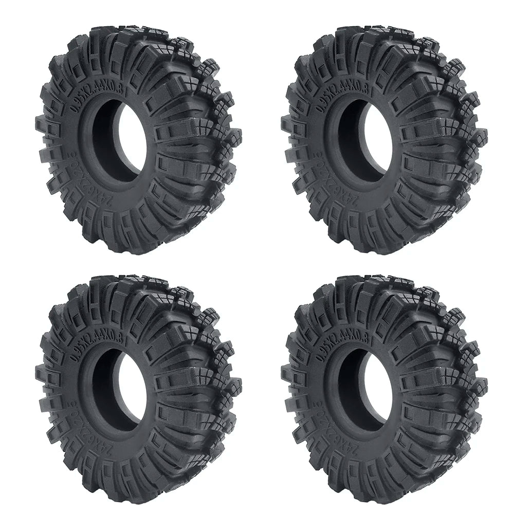 Quatre vues de roues en caoutchouc noir souple conçues pour voitures de crawl RC.