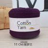 Purple cotton yarn skein labeled Cotton Yarn 100g with a measurement of 11 cm.