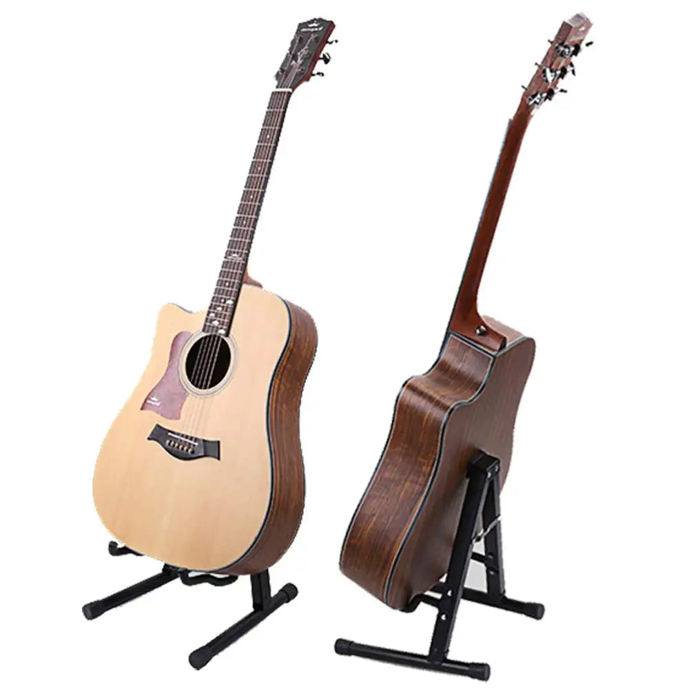 A wooden acoustic guitar is displayed on a black folding A-frame stand.