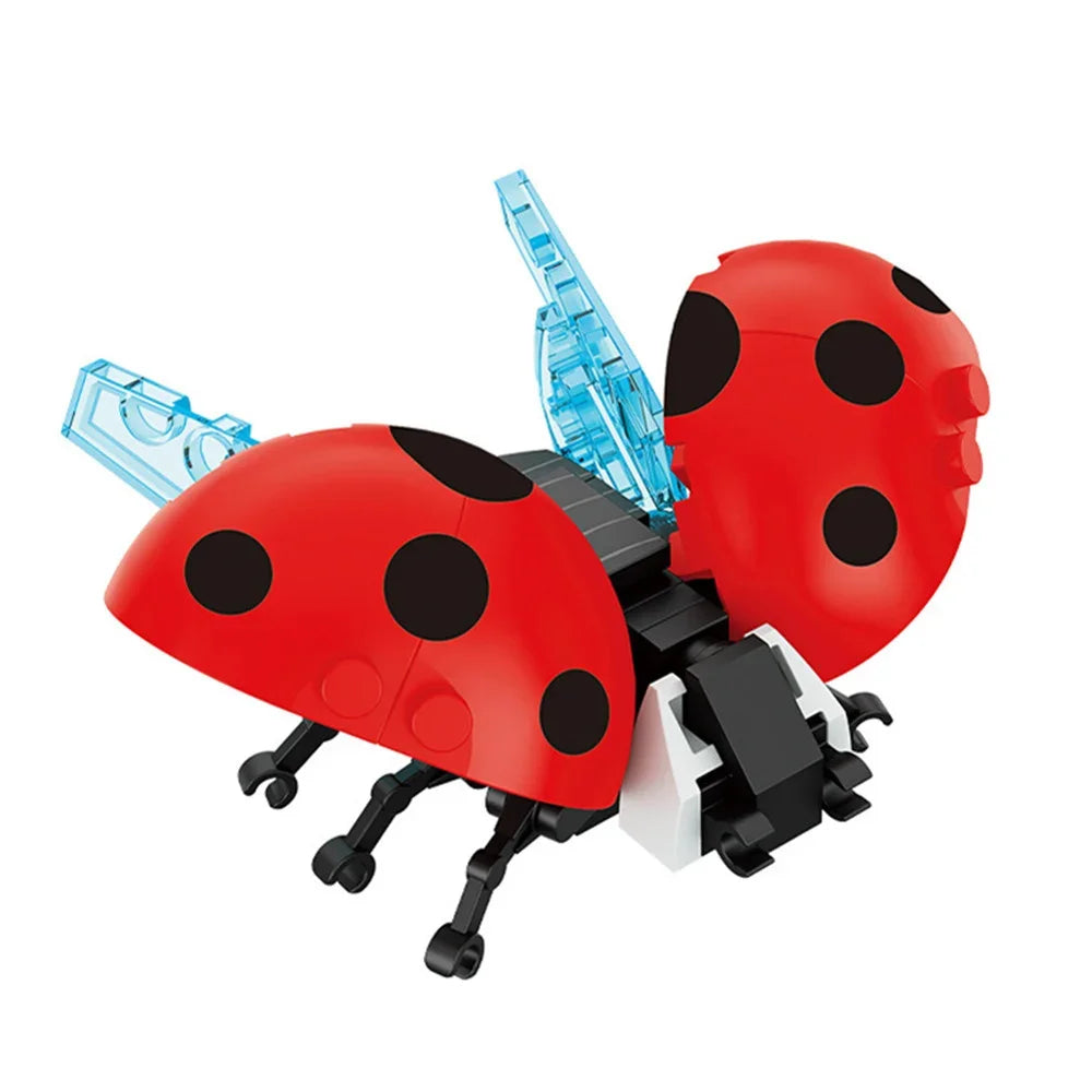 A red insect building block set featuring a ladybug design with blue antennae and black spots.