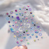 A sheet of 5D Bronzing Gothic Nail Art stickers with various iridescent and glittery designs