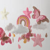 Handmade felt butterfly crib mobile featuring pink, beige, and gray stars and clouds