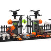 A black and orange haunted house set made of building blocks featuring bats, pumpkins, and spooky decorations.