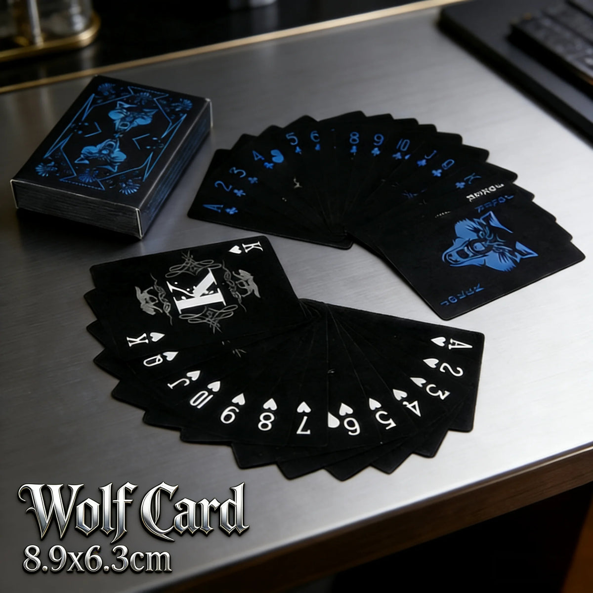 A stack of black Wolf Card playing cards is displayed on a gray surface.