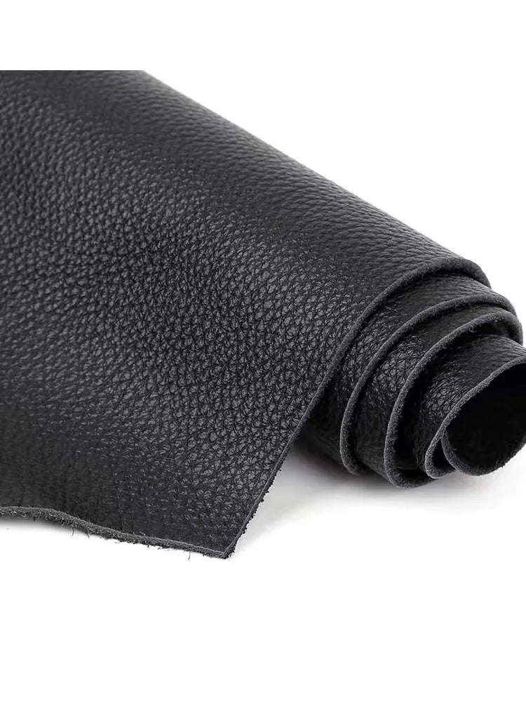 Roll of premium black cowhide leather with a lychee texture