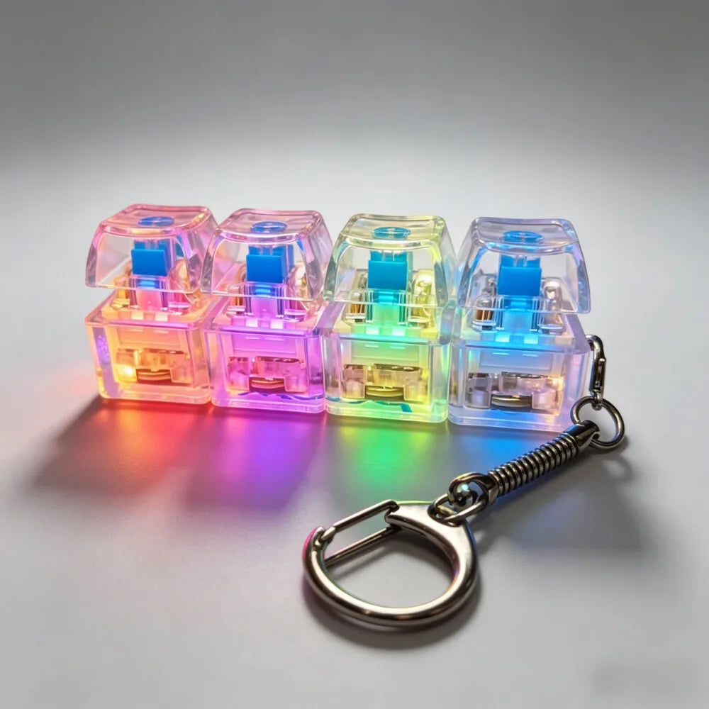 A set of four translucent LED light-up keycap fidget flashlights attached to a silver keychain.
