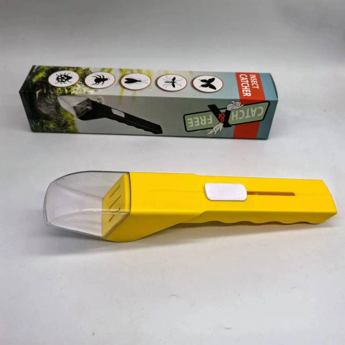 Yellow handheld insect catcher with a clear magnifying lens and a black handle.