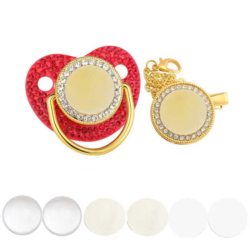 A set of red and gold rhinestone-accented baby pacifiers and clips.