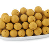 A pile of round, golden silicone beads for jewelry making and DIY crafts.