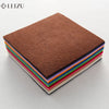 A stack of colorful non-woven felt fabric sheets in various colors, including brown, pink, green, and blue.