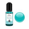 A small glass bottle of Sky blue resin pigment with a black cap and a large, round teal bead.