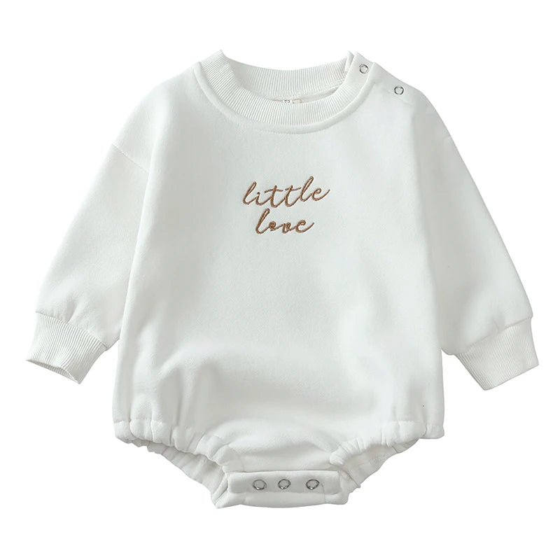 White cotton baby romper with 'little love' embroidery