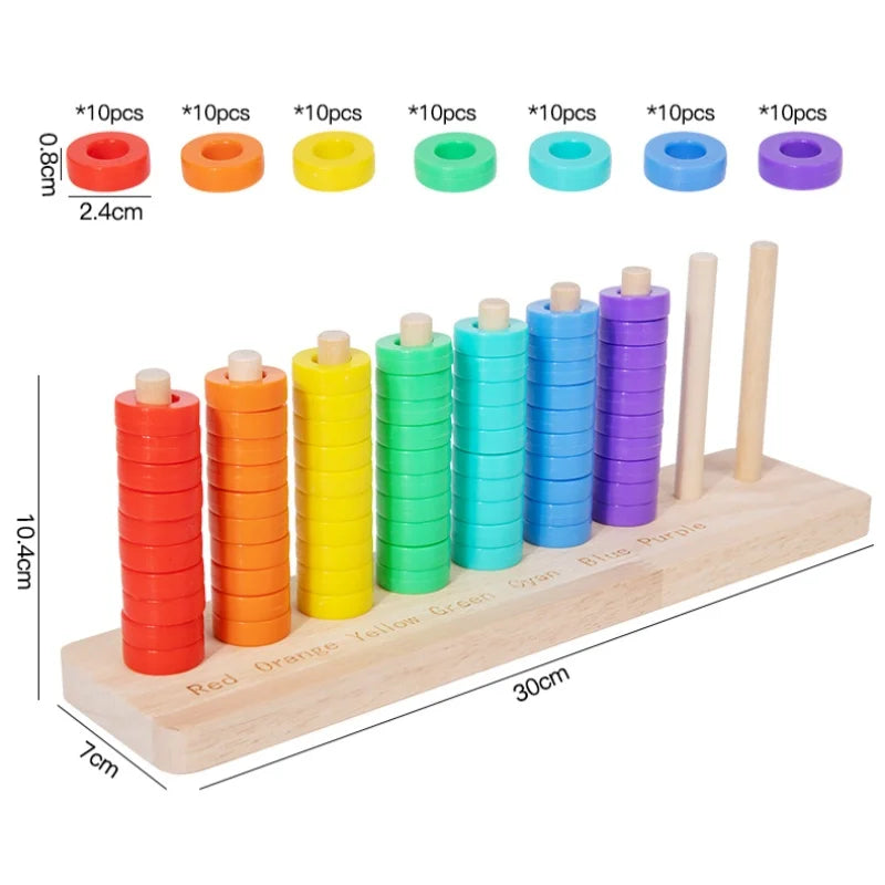 A wooden ring toss game featuring colorful rings in red, orange, yellow, green, and blue, stacked on a wooden board.