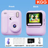 Front and back views of a pink instant print camera showing the device, paper, and accessories.