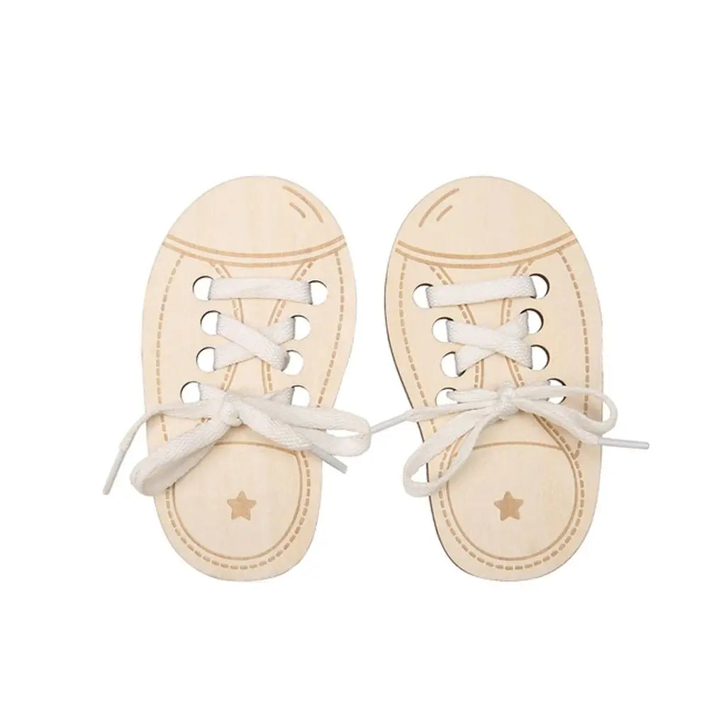 Pair of light wood lacing shoes used as a fine motor skills toy