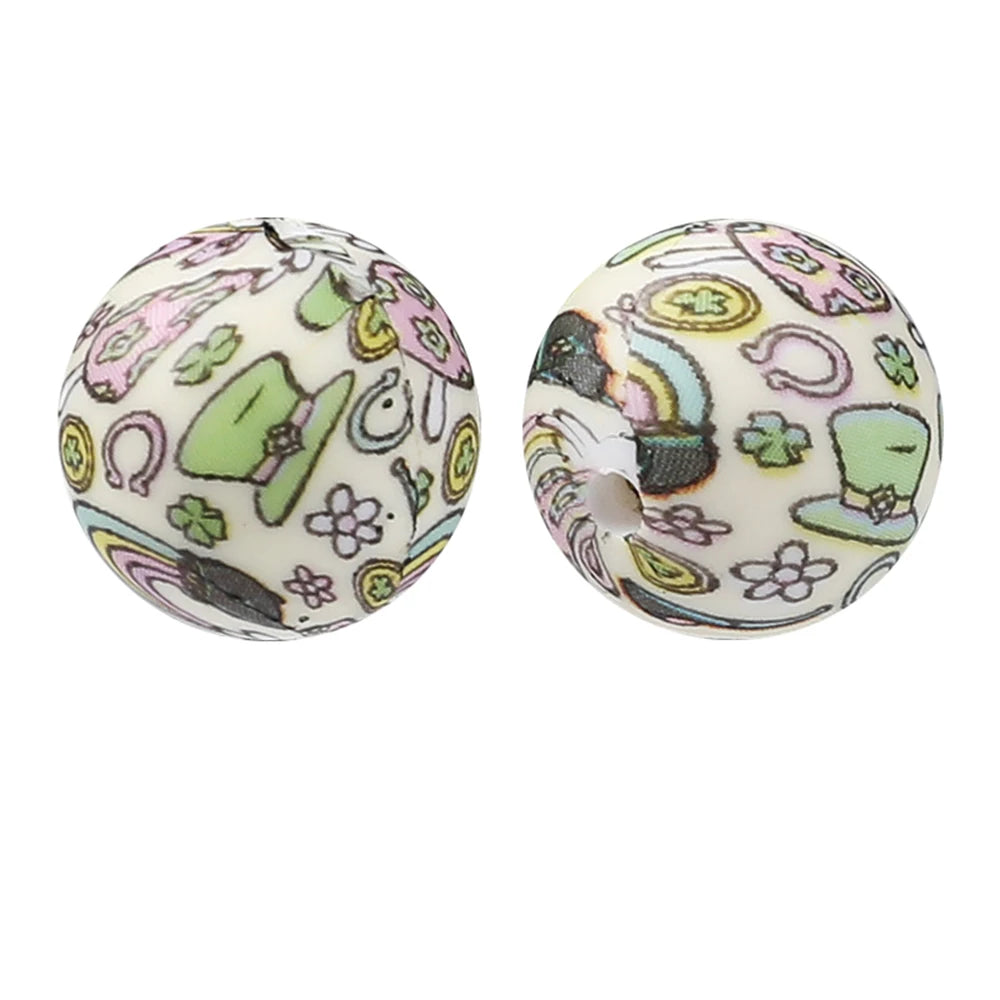 Two round silicone beads featuring pastel floral and whimsical patterns for jewelry making