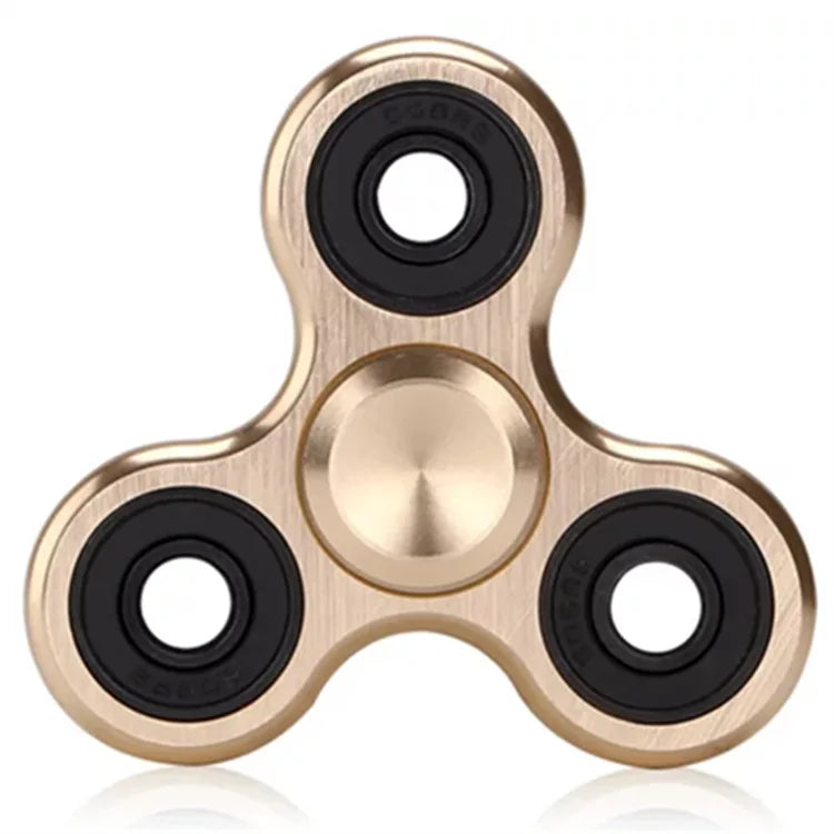 A gold-toned aluminum alloy fidget spinner with four bearing holes.